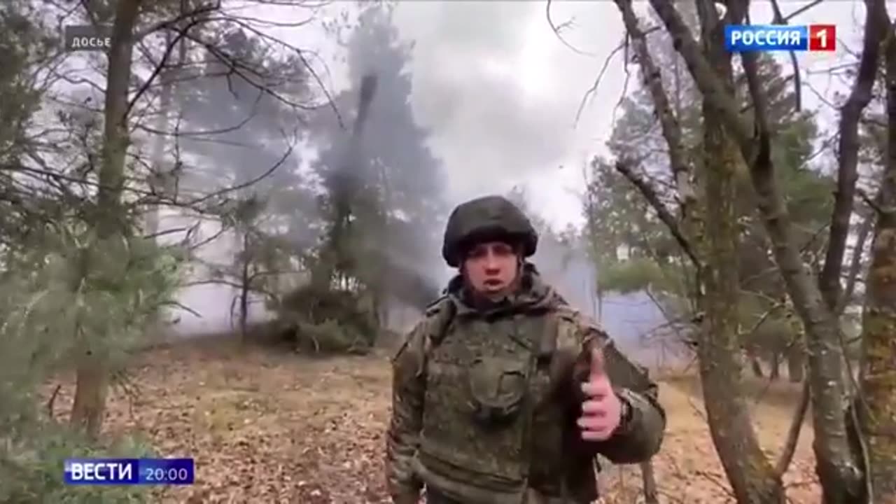 Members of the Russian Press Service take arty fire while shooting a segment