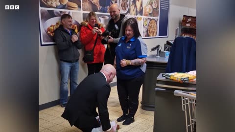 Aldi worker gets engaged while working on the checkout