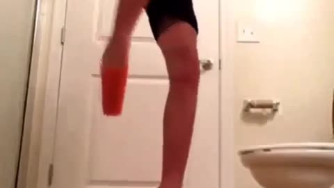 Man fall down when he used plastic glasses to dance