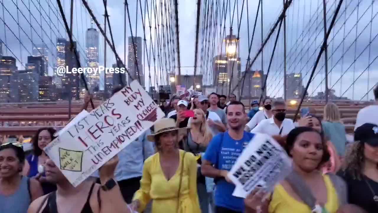 Protesters against mandatory vaccinations chant "F*** Joe Biden"