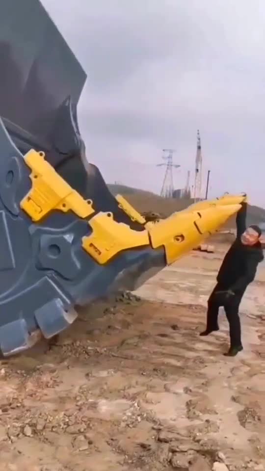 What a beautiful Chinese guy capture a photo with hydrulic crane.