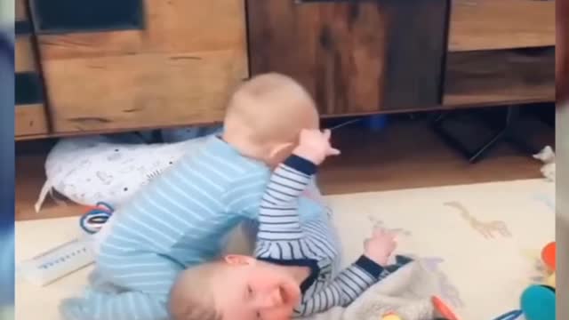 Funny fighting of twin brothers