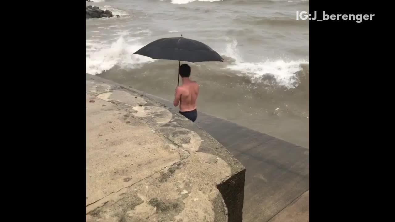 Huge waves takes guy down