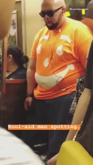 Man in orange kool aid man shirt