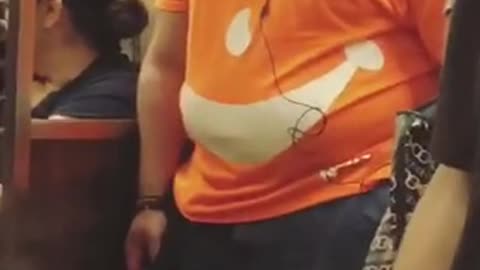 Man in orange kool aid man shirt