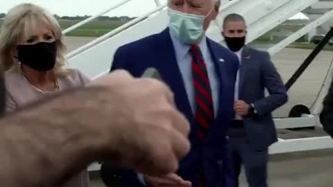 Joe Biden got stuck at the airport with his hand out