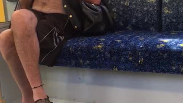 Man casually plays flute on subway train