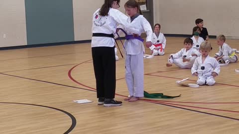 Ellie is awarded her purple belt