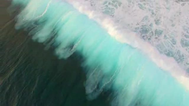 Blue Waves Breaking Over Reef