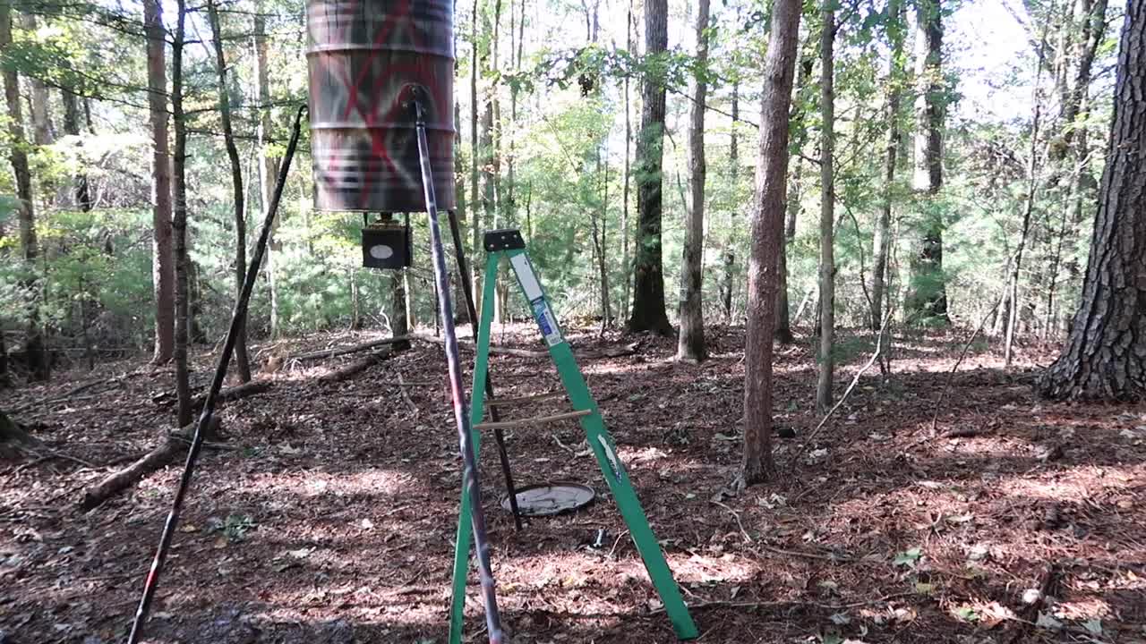 Filling Deer Feeder With CORN SOAKED IN PEANUT OIL WITH PEANUTS