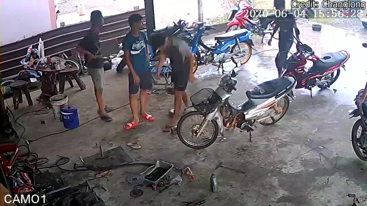 Moped Crashes into Garage