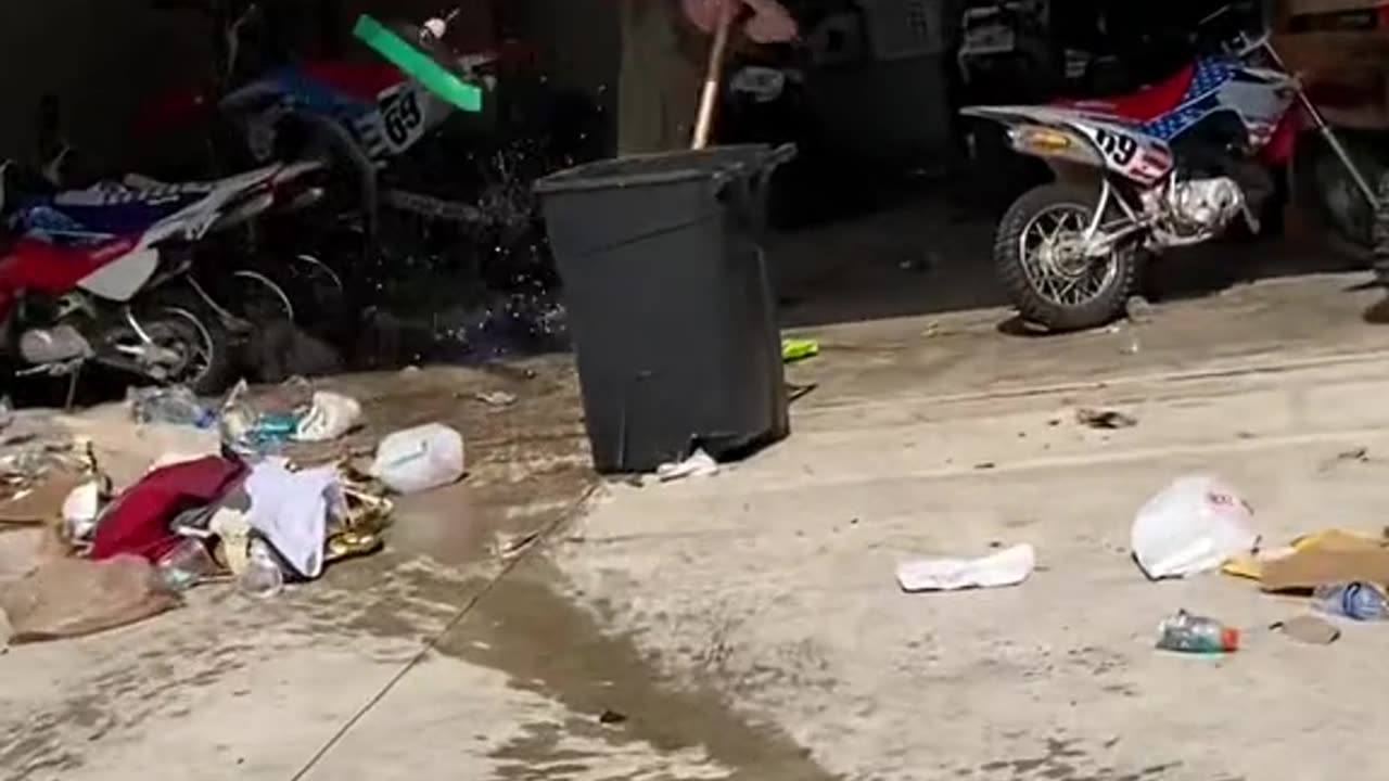 guy throws bottle of soft drink and it rockets back at him.