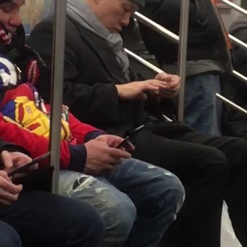 Man clips fingernails on subway train
