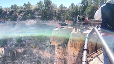 Tourists Hop Over Railing at Grand Canyon