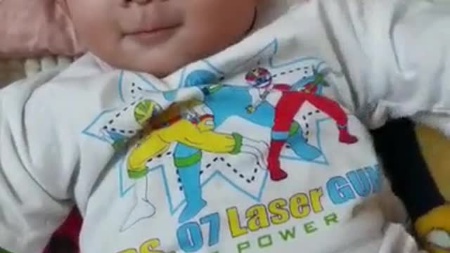 Looking baby boy happy like talking