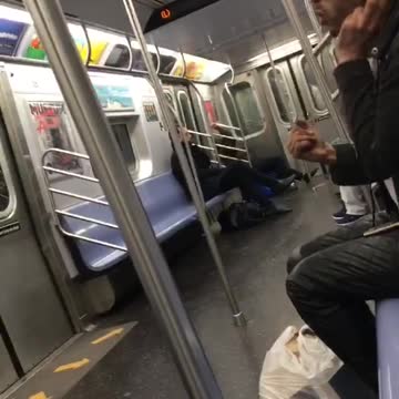 Headphones guy sings beatles come together on subway car