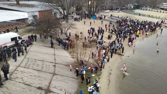 People plunge into cold water