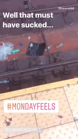 Broken computer on subway tracks