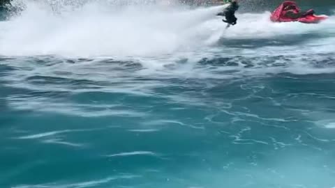 Boy and girl are flying In the pool