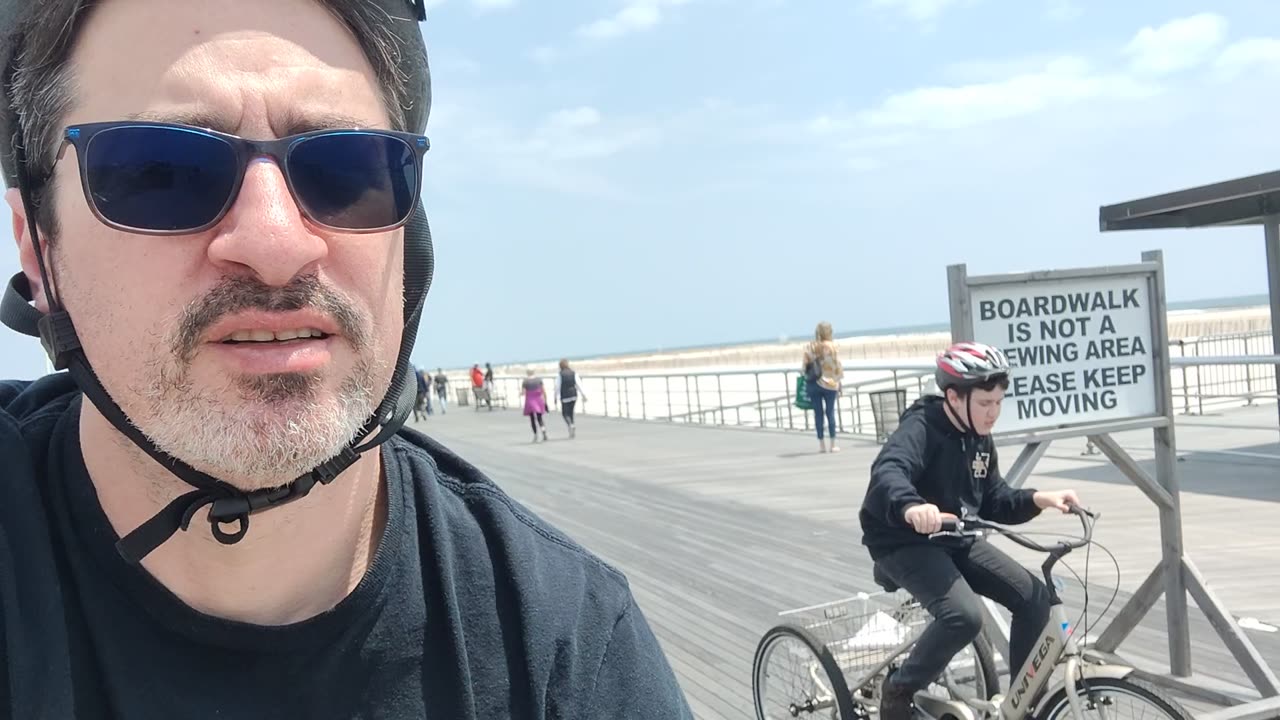 Spencer riding his tricycle at Jones beach air show VID_20230521_130026