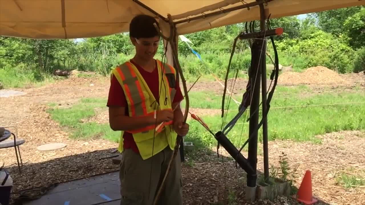 Reece shoots his primitive stick bow