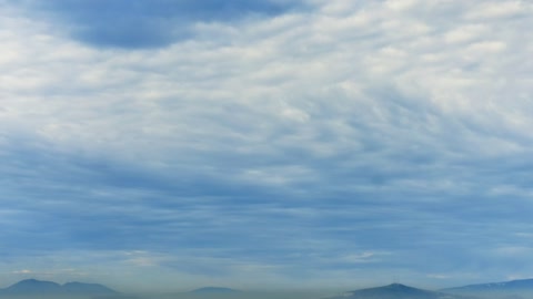 White clouds moving over the mountains