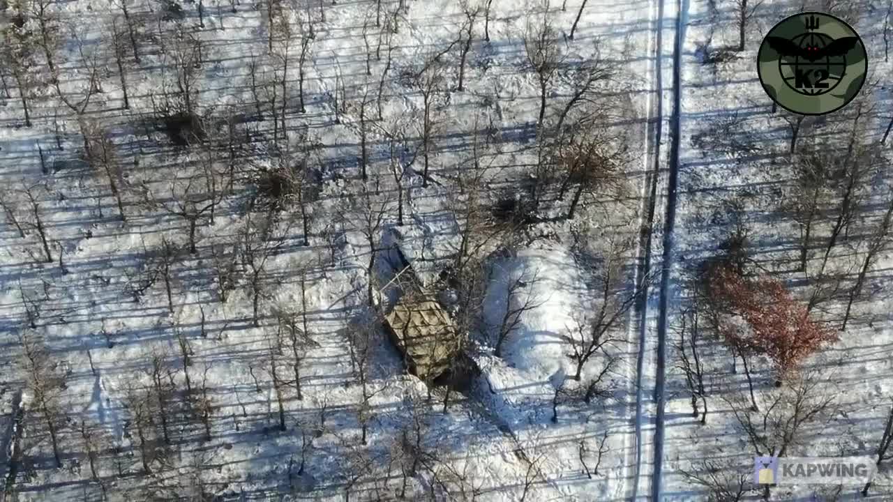 drone footage of Ukranian forces strikes on T- 72 tank and BMPs in the snow forest