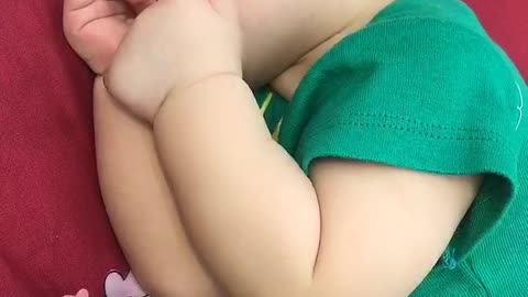 The boy is sleeping but still craving food