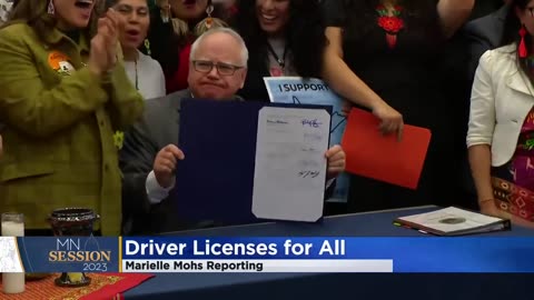 Tim Walz signing a law that provides drivers license’s for illegal aliens