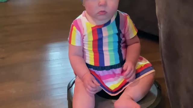 Baby rides on Roomba