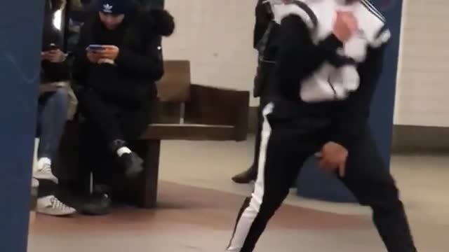 Guy dances and front flips to "bring me to life" song in subway station