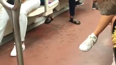 Man sings play piano and holds onto dolls