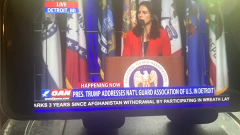Tulsi Gabbie’s & Donald Trump seal in Detroit Michigan at national guard association